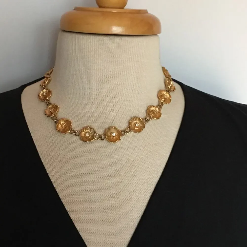 Vintage gold tone flower chain necklace with rhinestone accents